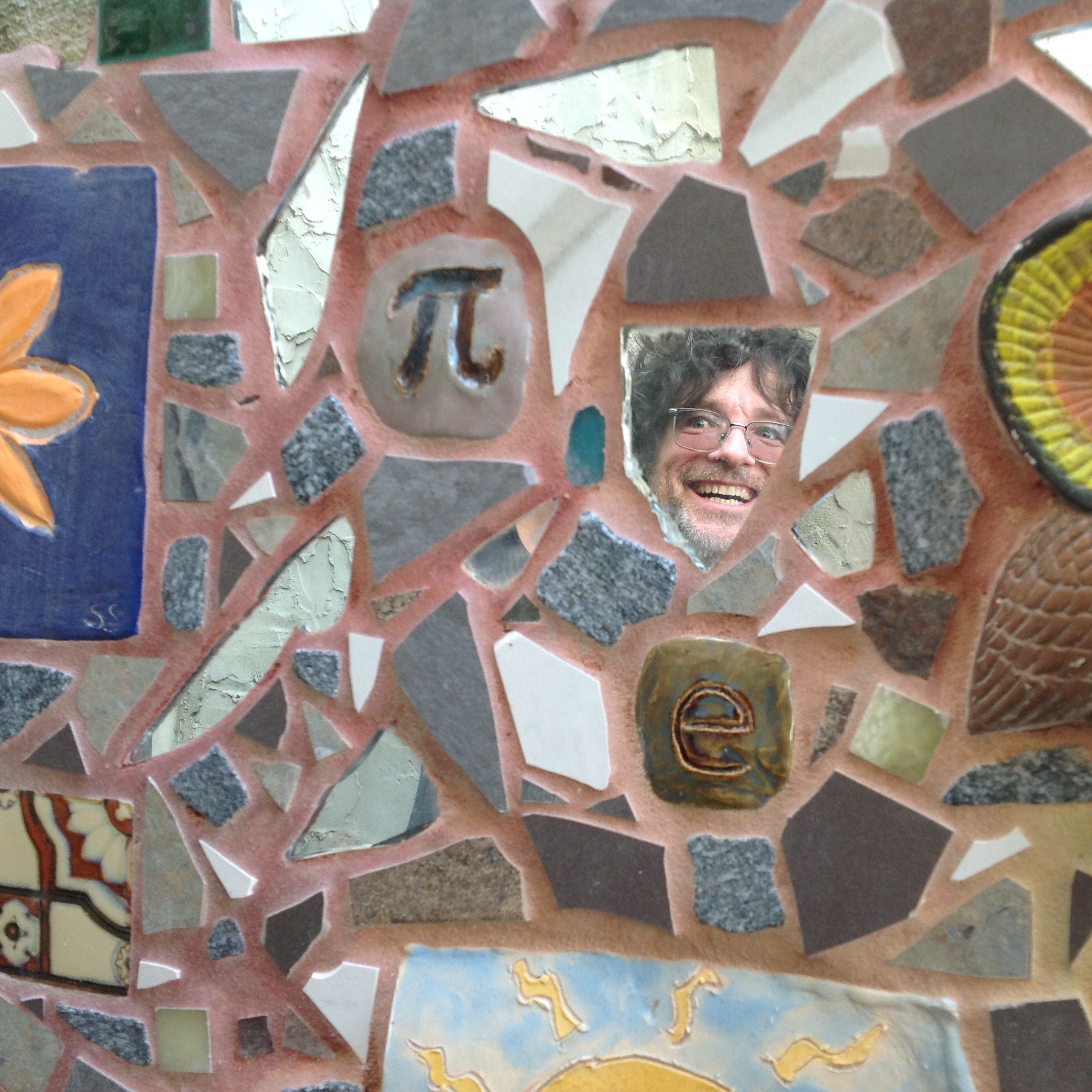 Mosaic with mirror reflecting the artist