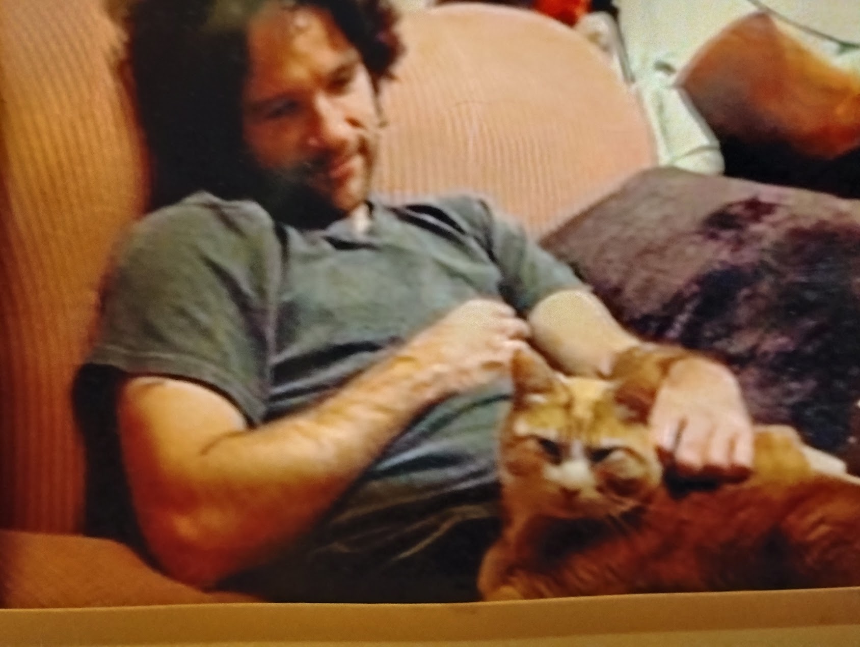 Andrew Breslin relaxing in a chair with Marmalade